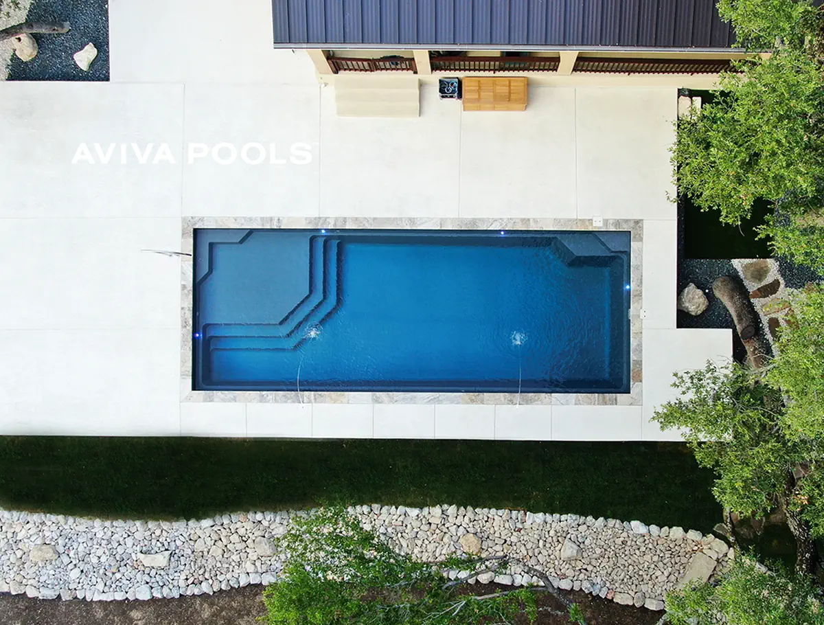 A fiberglass backyard swimming pool: the ideal way to elevate your new home building experience. 
